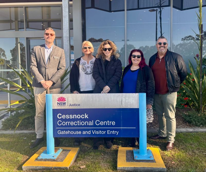 Five staff standing outside Cessnock Correctional Centre