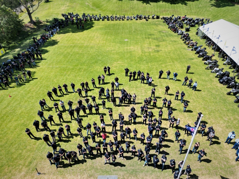 A large group gathered on a lawn