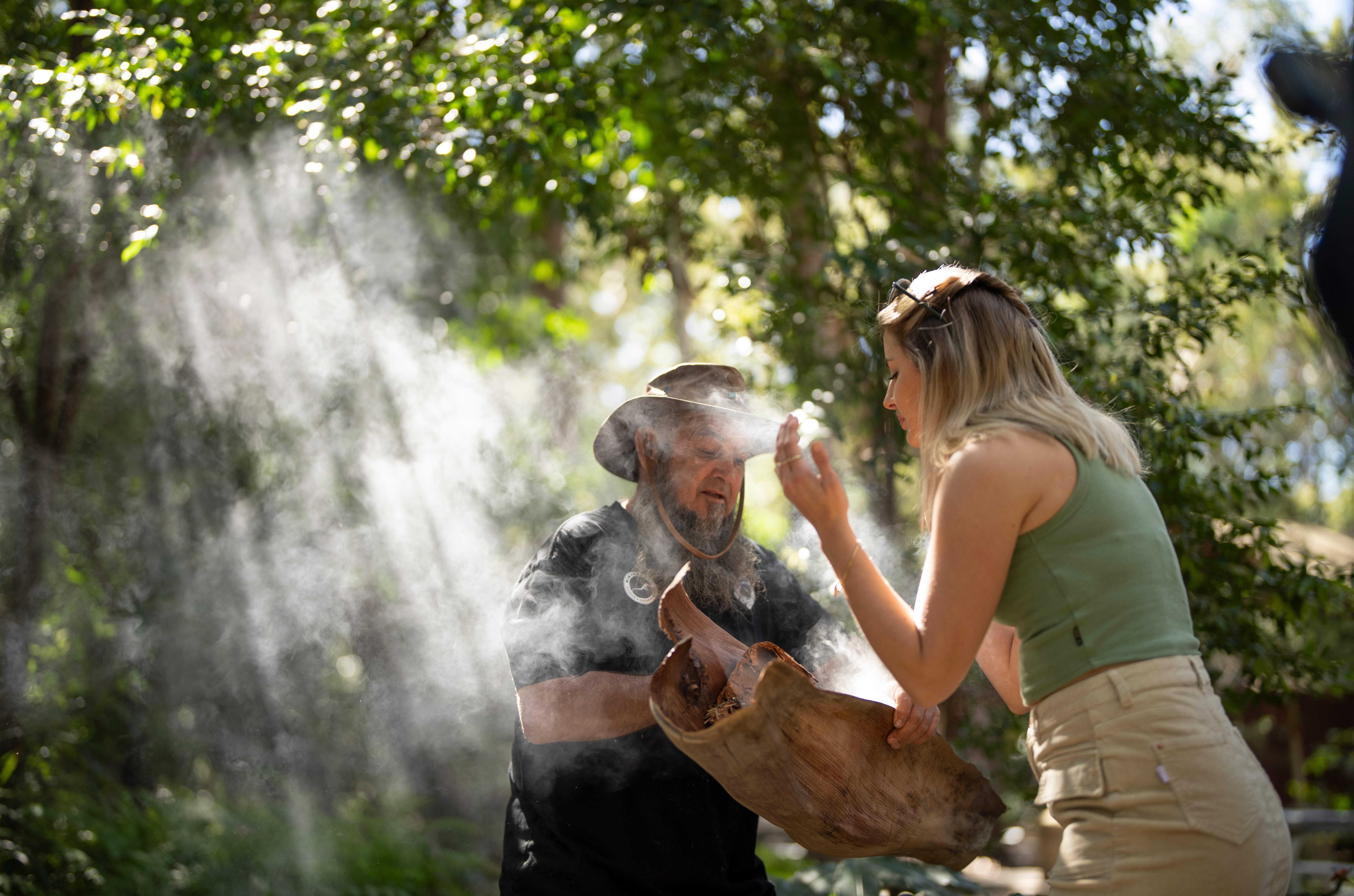 A smoking ceremony taking place in the bush