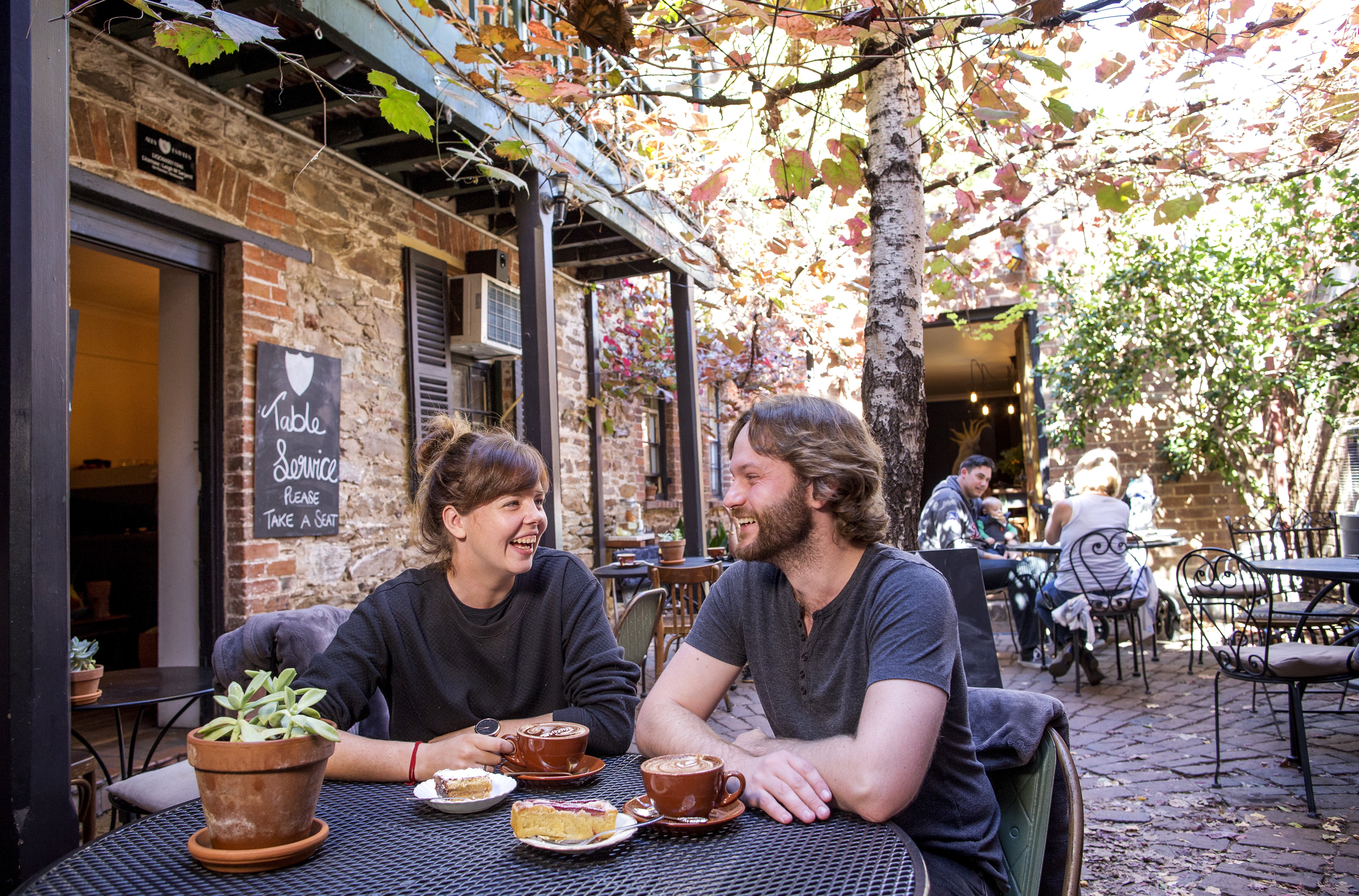 A photo of a couple enjoying a meal at Alby and Esthers