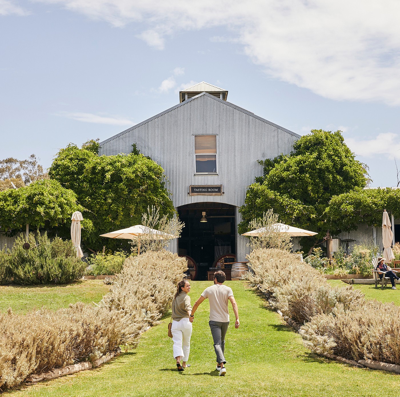 A photo of a couple in front of a shed at Lowe Wines