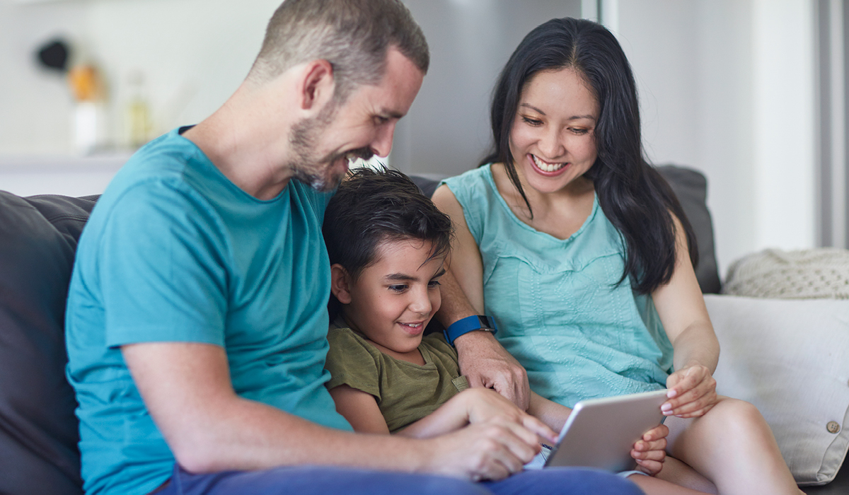 adults and child with tablet