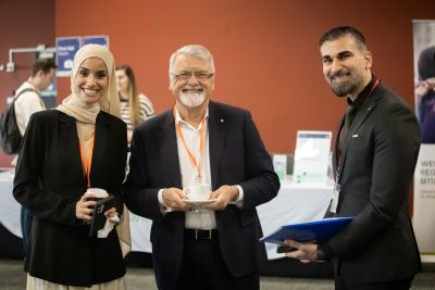 3 people networking during the break.