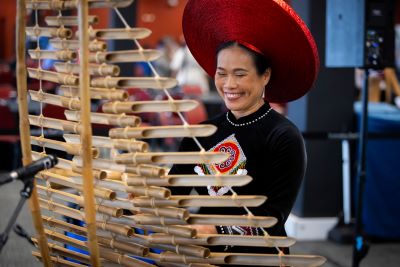 Minh Ha plays a traditional Bamboo Xylophone