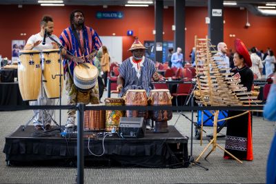 Multicultural Musicians Jam playing the drums and the bamboo xylophone