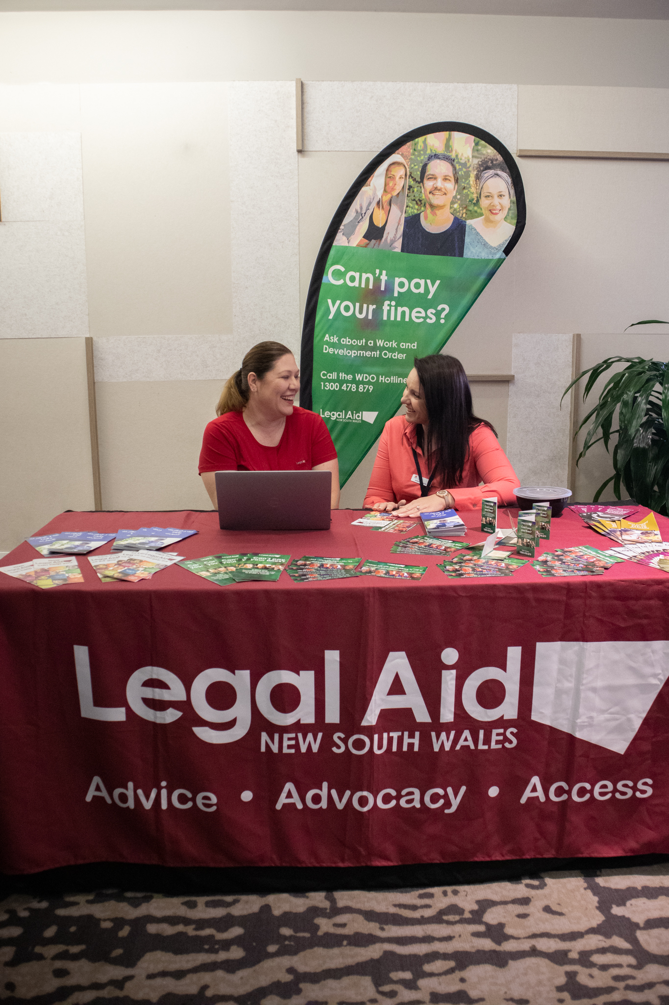 Two people at legal aid stall