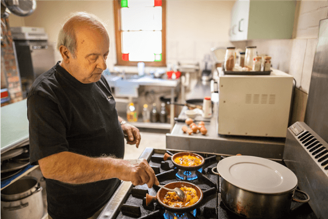 Bechora Dehab lebanese chef cooking over hot stove