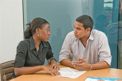 Man and woman discussing at table